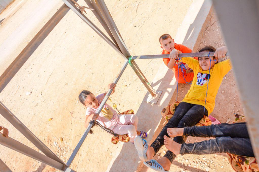 Syrian refugees play outdoors at the Zaatari Refugee Camp recently (Photo courtesy of UNHCR)